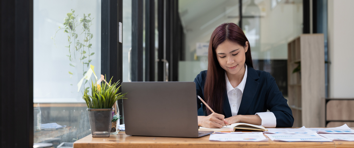 Business accountant asian woman using calculator for do math
